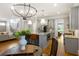 Kitchen seamlessly connects to the living area, boasting a large island, stairs and stainless steel appliances at 2685 Grady Se St, Smyrna, GA 30080
