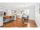 Kitchen area features breakfast bar, stainless appliances, light gray cabinets, and a hardwood floor at 2685 Grady Se St, Smyrna, GA 30080