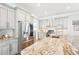 Bright kitchen with granite countertops, stainless steel appliances, and modern gray cabinetry at 2685 Grady Se St, Smyrna, GA 30080
