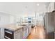 Bright kitchen featuring island with stainless steel appliances, granite counters, and open floor plan at 2685 Grady Se St, Smyrna, GA 30080