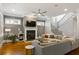 A welcoming living room with a fireplace, ceiling fan and hardwood floors at 2685 Grady Se St, Smyrna, GA 30080