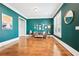Stylish living room with hardwood floors, dark teal walls, and abundant natural light at 2685 Grady Se St, Smyrna, GA 30080