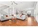 Open-concept living room flows into kitchen area, highlighting hardwood floors and modern design at 2685 Grady Se St, Smyrna, GA 30080