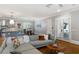 Open concept living room with doors to the outside and view of the kitchen at 2685 Grady Se St, Smyrna, GA 30080