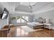 Bright main bedroom showcasing hardwood floors, tray ceilings, and natural light at 2685 Grady Se St, Smyrna, GA 30080