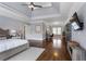 View of main bedroom showcasing hardwood floors, tray ceilings, and natural light at 2685 Grady Se St, Smyrna, GA 30080