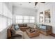 Comfortable sun room with ceiling fan, seating area, and lots of natural light at 2685 Grady Se St, Smyrna, GA 30080
