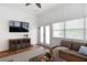 Inviting sun room featuring a ceiling fan and sliding glass doors for outdoor access at 2685 Grady Se St, Smyrna, GA 30080