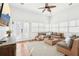 Bright sun room with neutral decor, wicker furniture, and natural light from many windows at 2685 Grady Se St, Smyrna, GA 30080