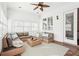 Cozy sunroom featuring comfortable wicker seating, neutral decor, and bright natural light at 2685 Grady Se St, Smyrna, GA 30080