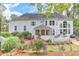 Expansive backyard with lush landscaping, a screened porch, and a spacious deck at 452 Brushstroke Se Ct, Marietta, GA 30067