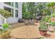 Relaxing backyard patio with an outdoor grill surrounded by beautiful greenery and landscaping at 452 Brushstroke Se Ct, Marietta, GA 30067