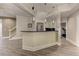 Open basement bar area with stainless steel appliances, modern lighting, and wood-look floors at 452 Brushstroke Se Ct, Marietta, GA 30067