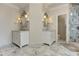 Luxurious bathroom with double vanity, marble countertops, decorative mirrors and a glass shower at 452 Brushstroke Se Ct, Marietta, GA 30067