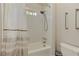 Bright bathroom features a shower-tub combination, white tile, and neutral-toned walls at 452 Brushstroke Se Ct, Marietta, GA 30067
