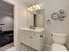 Bathroom vanity with drawers and a mirrored cabinet at 452 Brushstroke Se Ct, Marietta, GA 30067