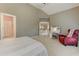 Bedroom featuring a small desk area, accent chair and a bathroom entrance at 452 Brushstroke Se Ct, Marietta, GA 30067