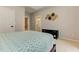 Neutral bedroom with a tray ceiling, with decor and a glimpse into an ensuite bathroom at 452 Brushstroke Se Ct, Marietta, GA 30067