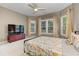 Bedroom features a ceiling fan, natural light, and neutral-toned walls at 452 Brushstroke Se Ct, Marietta, GA 30067