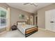 Bedroom featuring a bed, bedside table and a window with a view of trees at 452 Brushstroke Se Ct, Marietta, GA 30067