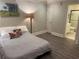 Cozy bedroom featuring wood-look floors, soothing wall colors, and access to an adjoining bathroom at 452 Brushstroke Se Ct, Marietta, GA 30067