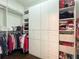 Spacious walk-in closet with custom shelving, drawers, and ample storage space at 452 Brushstroke Se Ct, Marietta, GA 30067