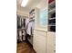 Organized walk-in closet featuring custom shelving and drawers for optimal storage at 452 Brushstroke Se Ct, Marietta, GA 30067