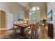 Formal dining room featuring a large window, chandelier, and elegant furnishings at 452 Brushstroke Se Ct, Marietta, GA 30067