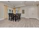 Open-concept dining room with hardwood floors, bright lighting, and access to backyard at 452 Brushstroke Se Ct, Marietta, GA 30067