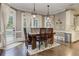 Dining area featuring hardwood floors, natural light, and wooden dining set at 452 Brushstroke Se Ct, Marietta, GA 30067