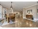 Open concept dining room featuring hardwood floors and decorative chandelier at 452 Brushstroke Se Ct, Marietta, GA 30067