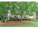 Brick home with lush green trees providing privacy at 452 Brushstroke Se Ct, Marietta, GA 30067