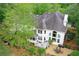 This home boasts a lovely back yard, complete with a seating area, landscaping, mature trees, and an outdoor patio at 452 Brushstroke Se Ct, Marietta, GA 30067