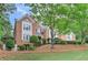 Brick home with lush green trees providing privacy at 452 Brushstroke Se Ct, Marietta, GA 30067