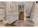 Traditional foyer with built-in storage, hardwood floors and a staircase leading to the next level at 452 Brushstroke Se Ct, Marietta, GA 30067