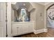Inviting foyer featuring custom cabinetry with stone countertops, hardwood floors, and elegant archway at 452 Brushstroke Se Ct, Marietta, GA 30067