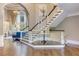 Grand foyer featuring a staircase, hardwood flooring, chandelier, and an open layout with elegant architectural details at 452 Brushstroke Se Ct, Marietta, GA 30067