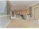 Wide hallway with plush carpeting, chandelier, and white wood trim throughout at 452 Brushstroke Se Ct, Marietta, GA 30067