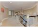 Hallway features a chandelier, stairway with white wood trim, and neutral color palette at 452 Brushstroke Se Ct, Marietta, GA 30067