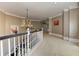 Hallway features a chandelier, stairway with white wood trim, and neutral color palette at 452 Brushstroke Se Ct, Marietta, GA 30067