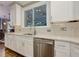 Modern kitchen with stainless appliances, a view of the dining room, and abundant counter space at 452 Brushstroke Se Ct, Marietta, GA 30067