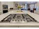 Spacious kitchen island featuring gas range and room for dining, plus access to the living room at 452 Brushstroke Se Ct, Marietta, GA 30067