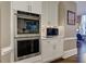 Modern kitchen with built-in oven and microwave near sitting area at 452 Brushstroke Se Ct, Marietta, GA 30067