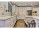 Well-lit modern kitchen with quartz counters, stainless appliances, and center island with barstool seating at 452 Brushstroke Se Ct, Marietta, GA 30067