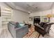 Cozy basement living area with custom built-ins, comfortable seating, and decorative rug at 452 Brushstroke Se Ct, Marietta, GA 30067