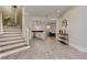 Open-concept living room with hardwood floors, staircase, and bar at 452 Brushstroke Se Ct, Marietta, GA 30067