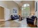 Spacious living room with a large window, chandelier, and elegant furnishings creating a comfortable atmosphere at 452 Brushstroke Se Ct, Marietta, GA 30067
