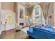 Bright living room with fireplace, built-in shelving, hardwood floors, and ample natural light at 452 Brushstroke Se Ct, Marietta, GA 30067