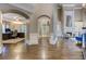 Open-concept living area featuring hardwood flooring, elegant archways, and a cozy fireplace with built-in shelving at 452 Brushstroke Se Ct, Marietta, GA 30067
