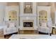 Charming living room with a fireplace, built-in shelving, and comfortable seating at 452 Brushstroke Se Ct, Marietta, GA 30067